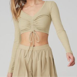 alo yoga ribbed cinch cropped long sleeve top in california sands